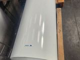 a large white tank sitting on top of a pallet