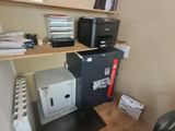 an image of a home office with a printer and printer cabinet