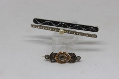 three different types of hair clips on a white surface