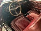 an image of the interior of a car with red leather seats