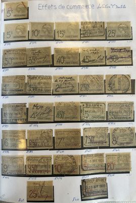 a lot of old paper money on display in a glass case