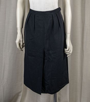 a mannequin wearing a white shirt and black skirt