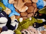 a pile of stuffed animals sitting on top of each other