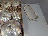 a box of silverware sitting on a white table