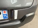 a sticker on the bumper of a car with a star on it