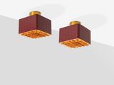 pair of red and gold square stud earrings on a white surface