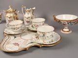a tray that has a tea set on it