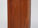 an image of a small wooden cabinet with a marble top