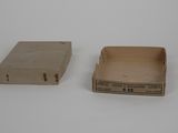 two empty boxes sitting on a white surface
