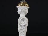 statue of a woman with a crown on her head on a black background