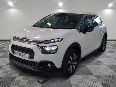 the white citrole is parked on a checkered floor