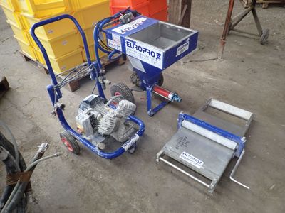 a small machine that is sitting on the ground next to other items