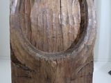 a large piece of wood that has a horseshoe on it