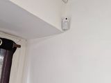 a picture of a white room with a window and a curtain