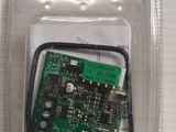 a close up of a small electronic device in a plastic container
