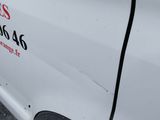 a white van that has a sign on the side of it