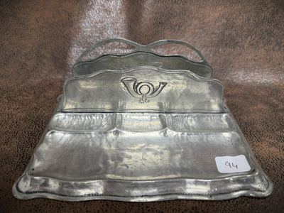 a metal tray that has a handle on it