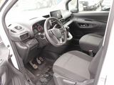 the interior of a small car with a steering wheel and dashboard