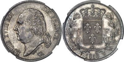 a close up of a coin with a crown on top of it