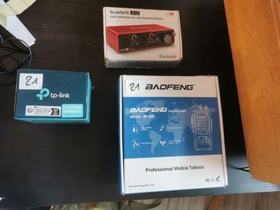 three boxes of electronic equipment on a table