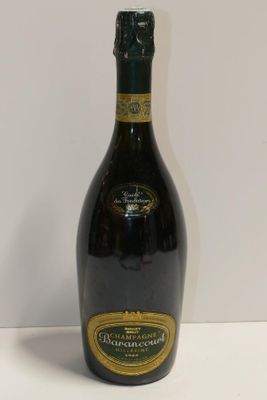 a close up of a bottle of wine on a table