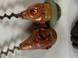 two wine openers that are sitting next to each other
