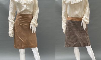 two mannequins dressed in white shirts and brown skirts