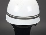 an image of a white helmet sitting on top of a black base