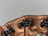 a person holding a purse that has a tissue in it