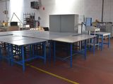 a room with tables and chairs in it that are empty