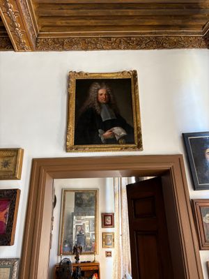 a painting on the wall above a doorway in a room