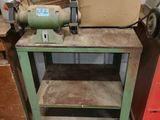 a machine that is sitting on a table in a garage