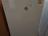 a refrigerator that is sitting on a pallet in a warehouse