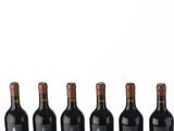 six bottles of red wine lined up in a row against a white background