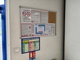 a picture of a wall with a bunch of signs on it