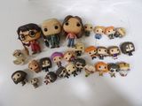 a lot of harry potter figurines on the table