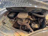 an old car engine with a lot of rust on it