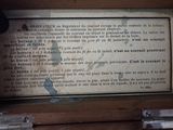 a sign on the side of a wooden box