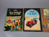 three children ' s books are lined up on a white surface