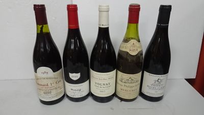 six bottles of wine are lined up on a table