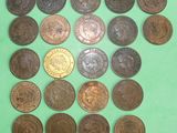 a close up of a bunch of coins on a green surface