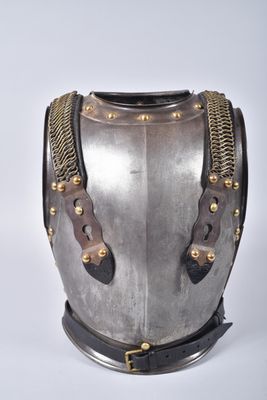 an old helmet with a chain around the neck and a chain around the neck