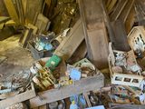 a pile of junk in the corner of a room