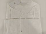 the shirt is white and has a button down collar