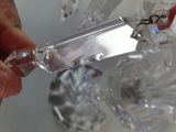 a person holding a piece of crystal in their hand