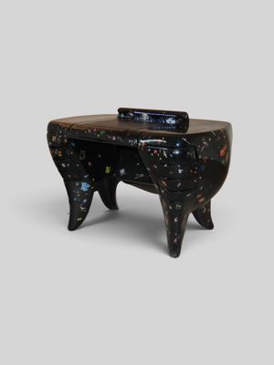 an image of a black table with a clock on top of it