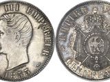 a close up of a coin with a crown on top of it