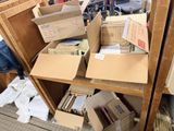many boxes on a shelf in a room