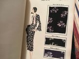 an open book with a picture of a woman in a dress on it