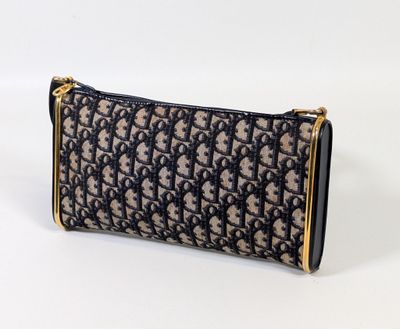 a brown and black purse with a gold handle